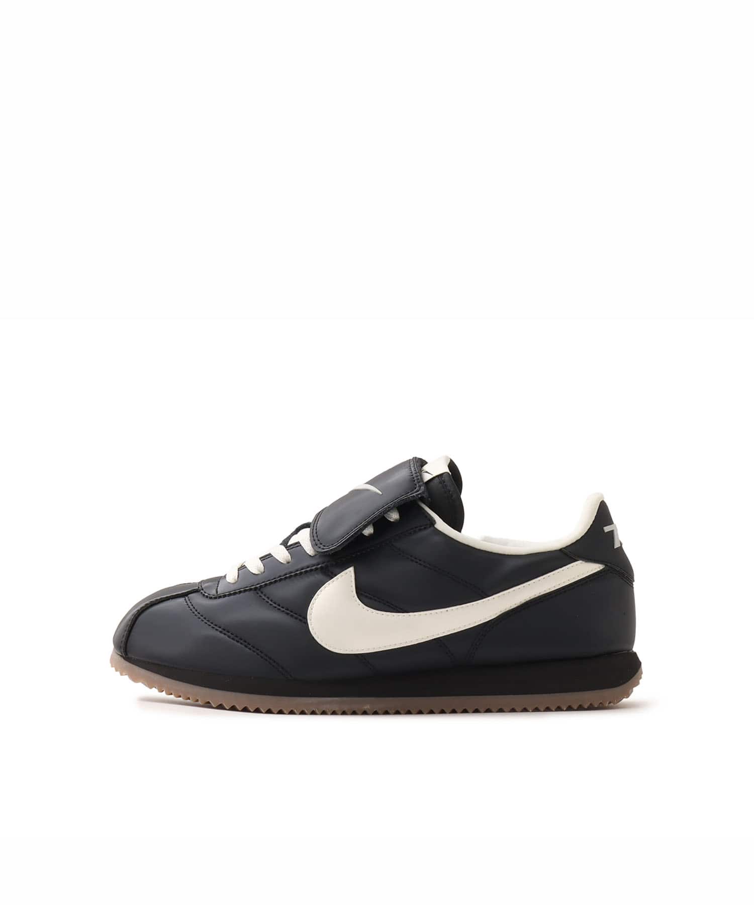 NIKE CORTEZ SE BLACK/SAIL-GUM DARK BROWN-MTLC DARK GREY（ナイキ