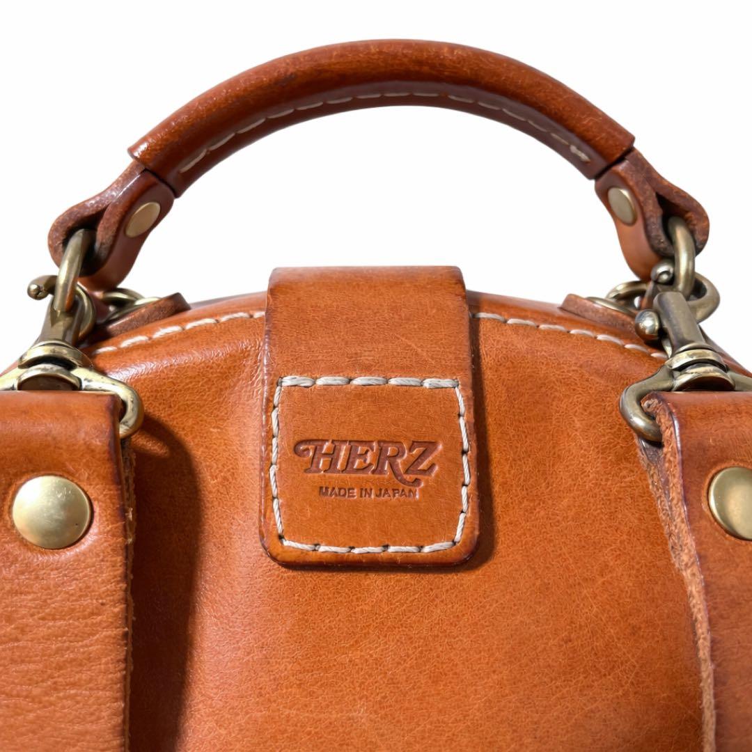 ヘルツ わんぱくリュック がま口 レザー バックパック ロック金具 鍵